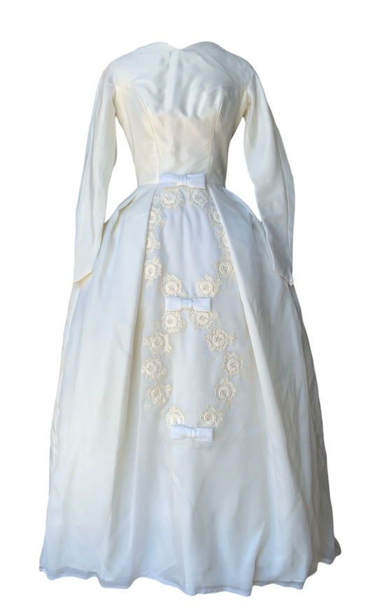 Early-mid ‘60s Satin Ballgown style with peaked bateau neckline